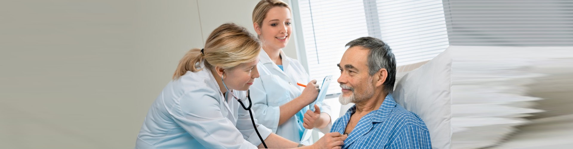 doctor and her assistant checking the patient's health